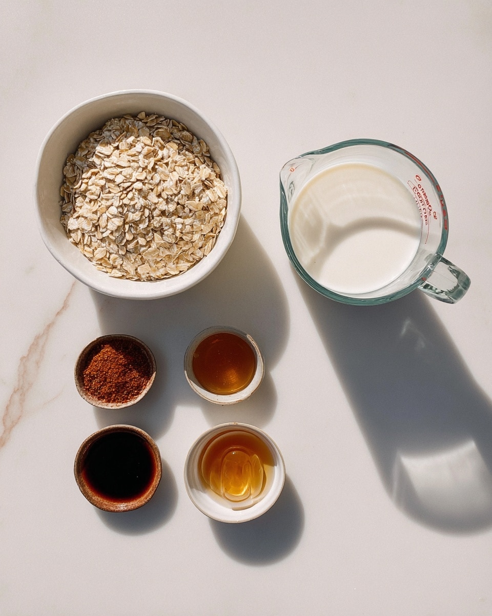 The image shows six small containers of different ingredients arranged on a white marbled surface. On the left, there is a white bowl filled with light brown rolled oats. To the right of the oats, there are four small round dishes in a horizontal line: the first has a reddish-brown powder, the second holds a small amount of honey which is golden and shiny, the third contains a dark brown liquid that looks like vanilla, and the fourth has a pinch of white salt. On the far right, there is a clear glass measuring cup filled with white milk, casting a soft shadow. The light is bright and natural, creating gentle shadows around the containers. Photo taken with an iphone --ar 4:5 --v 7
