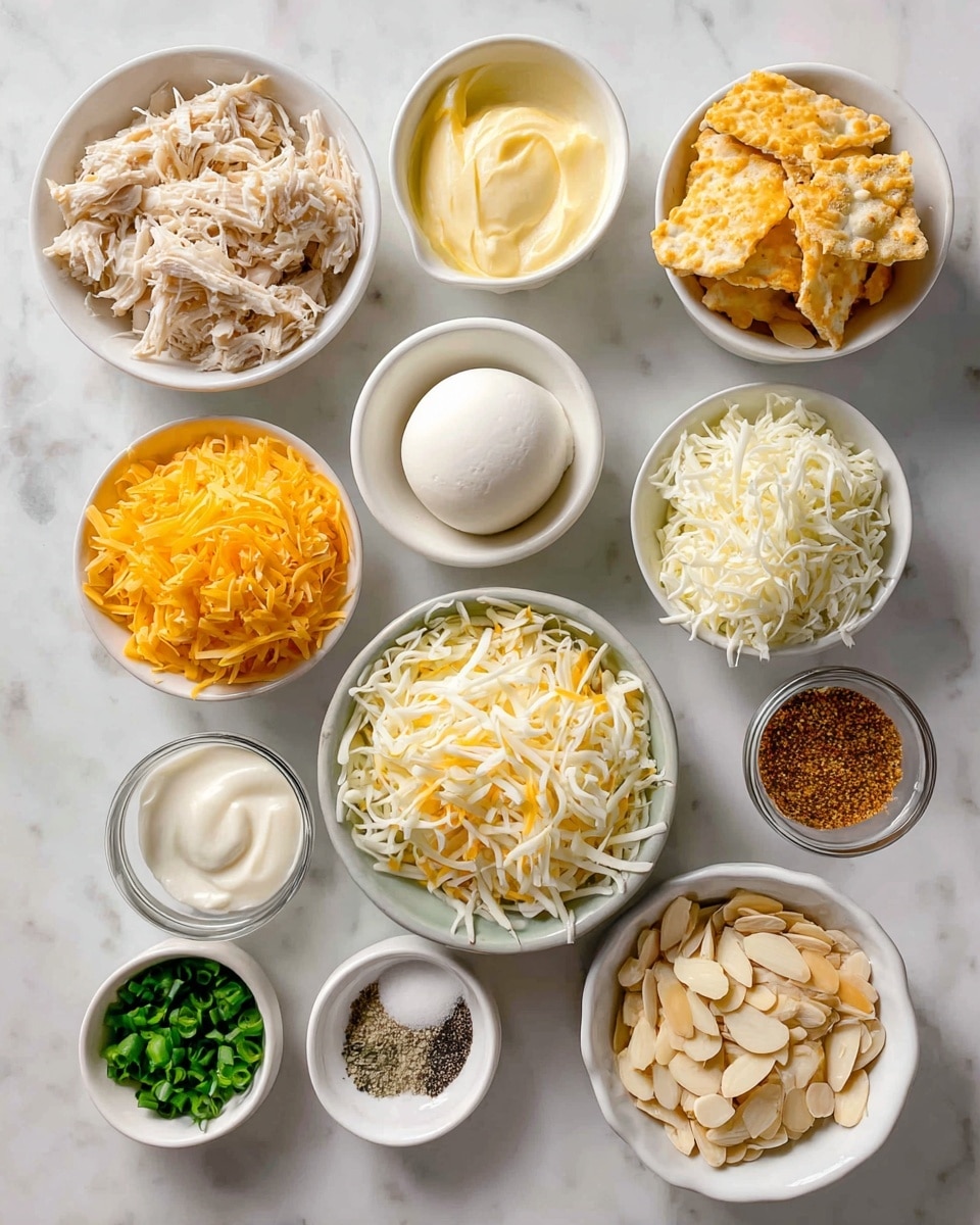 The image shows multiple small white bowls arranged neatly on a white marbled surface, each containing different cooking ingredients. From top left to bottom right, there is shredded light beige cooked chicken, golden crushed crackers, a smooth white ball of cream cheese, bright yellow melted butter, a pile of shredded orange cheddar cheese, a heap of shredded white mozzarella cheese, a white creamy sour cream, two tiny white bowls with black pepper and salt, a small white bowl with light brown garlic powder, finely chopped green onions, a white bowl of pale mayo, a bowl with light beige almond slices, two small white bowls filled with light brown onion powder and finely chopped parsley. The lighting is soft and natural, highlighting the textures and colors clearly photo taken with an iphone --ar 4:5 --v 7